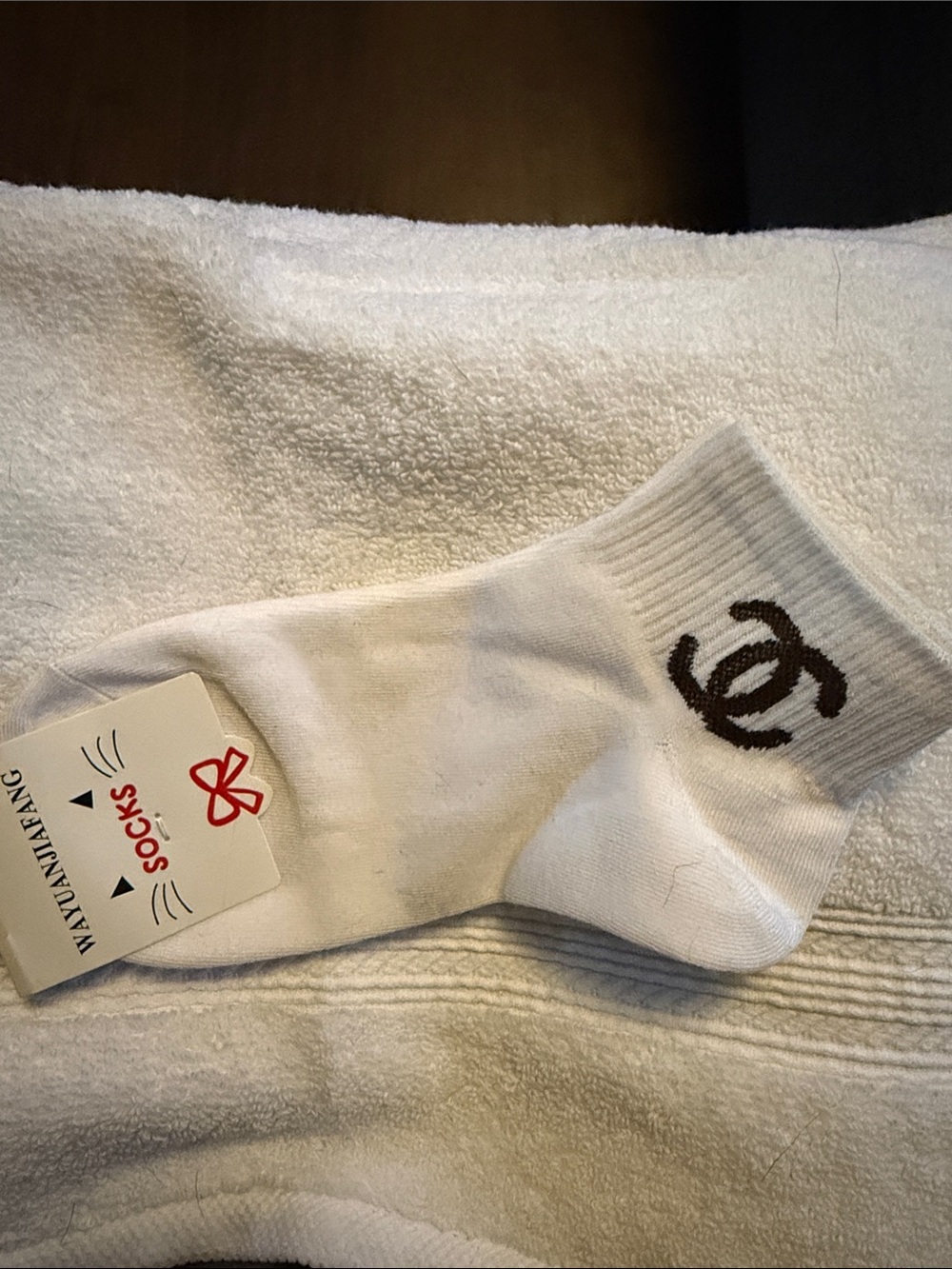 White Women's Crew Socks with Black Emblem